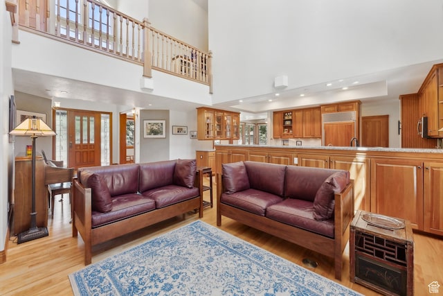 1 Spyglass Ct, Park City, UT 84060 - living room featuring a high ceiling and light hardwood / wood-style floors