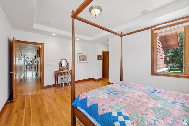 1 Spyglass Ct, Park City, UT 84060 - bedroom with a tray ceiling and light hardwood / wood-style floors