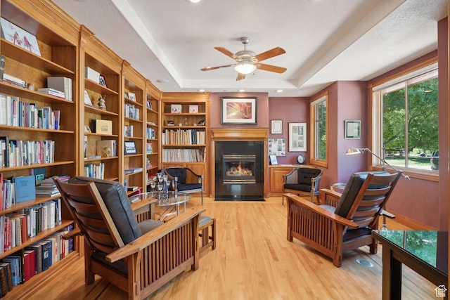 1 Spyglass Ct, Park City, UT 84060 - living area with light wood-type flooring, ceiling fan, and a tray ceiling