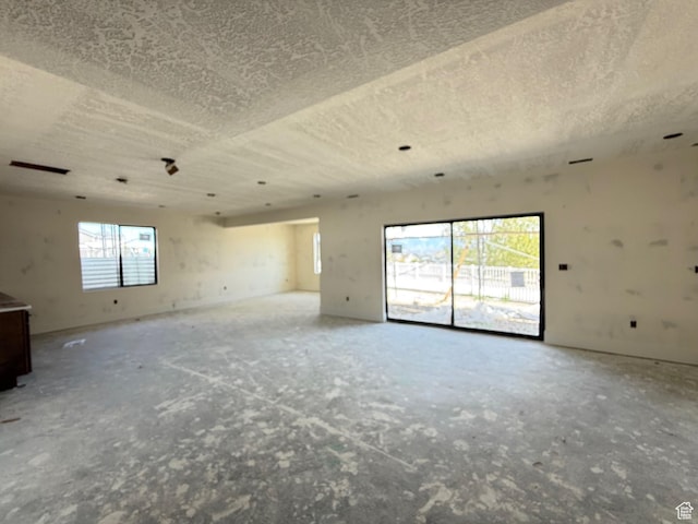 unfurnished room featuring a textured ceiling