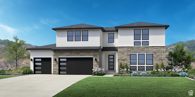 view of front of home with a garage and a front yard
