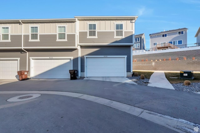 townhome / multi-family property with a garage