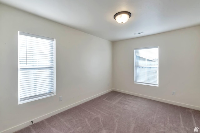 view of carpeted spare room