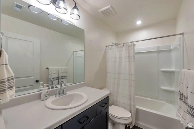 full bathroom with toilet, vanity, and shower / bath combo