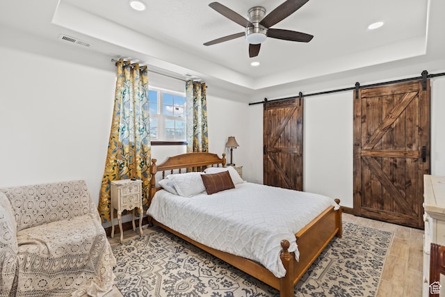 87 N 100 W, Marysvale, UT 84750 - bedroom with ceiling fan, a barn door, and a raised ceiling