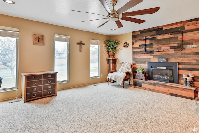 1450 E Gordon Ave N, Layton, UT 84040 - sitting room featuring ceiling fan, wood walls, and carpet flooring