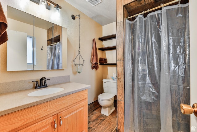 1450 E Gordon Ave N, Layton, UT 84040 - bathroom with toilet, a shower with shower curtain, wood-type flooring, a textured ceiling, and vanity