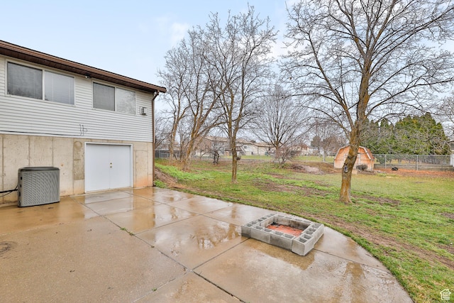 1450 E Gordon Ave N, Layton, UT 84040 - view of patio featuring central AC and a fire pit
