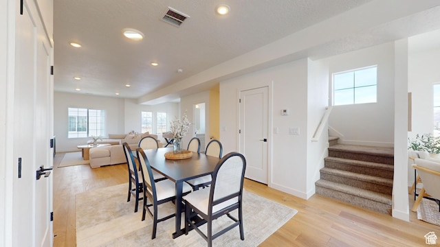 dining space featuring light hardwood / wood-style floors