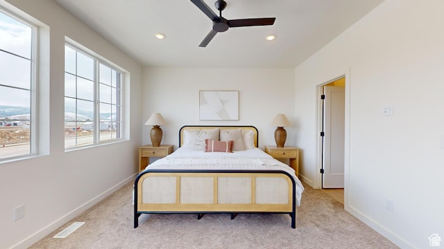carpeted bedroom with ceiling fan