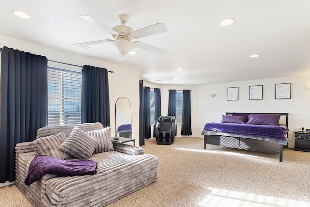 carpeted bedroom featuring recessed lighting and multiple windows