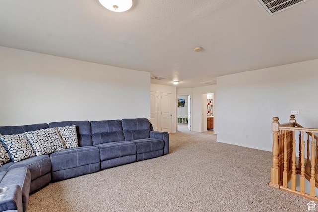 carpeted living room with visible vents