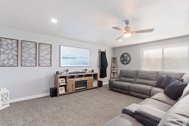living room featuring recessed lighting, ceiling fan, baseboards, and carpet