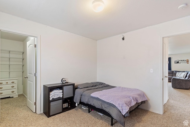 bedroom with light carpet