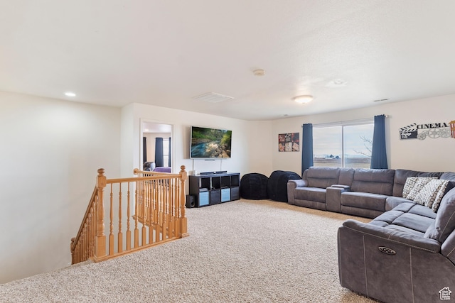 living area featuring carpet floors