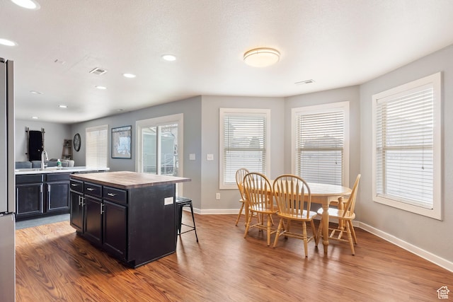 kitchen with baseboards and wood finished floors