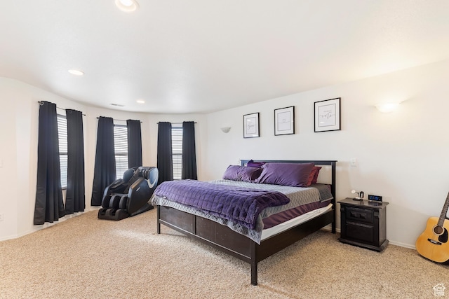 carpeted bedroom featuring recessed lighting and baseboards