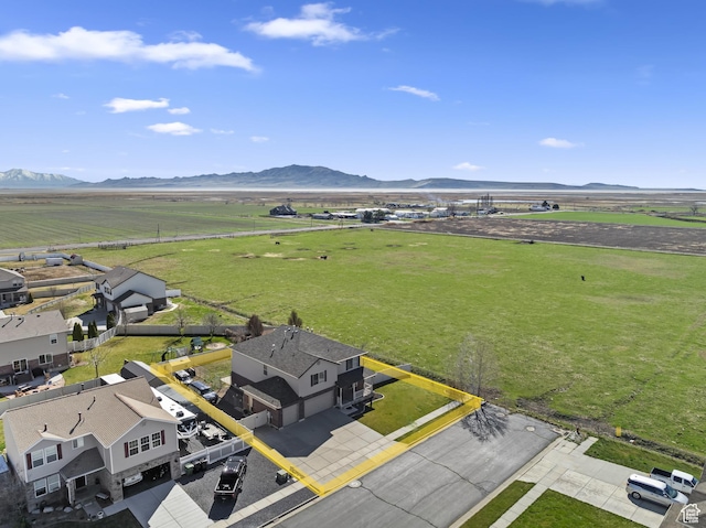 birds eye view of property with a mountain view and a rural view