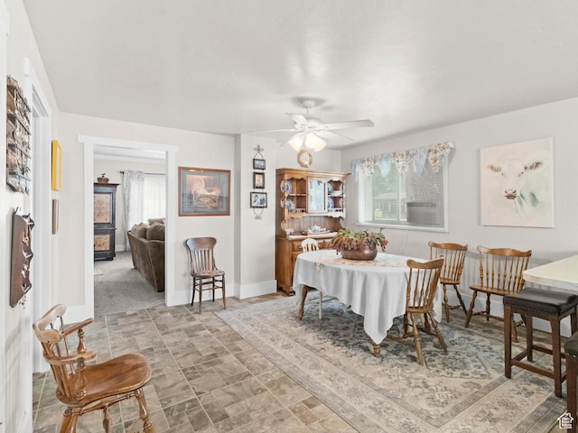 dining area with ceiling fan and a wealth of natural light