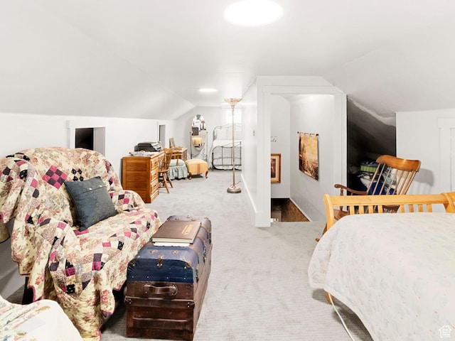 carpeted bedroom with vaulted ceiling