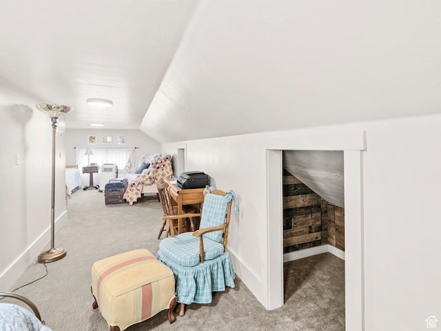 carpeted bedroom with lofted ceiling