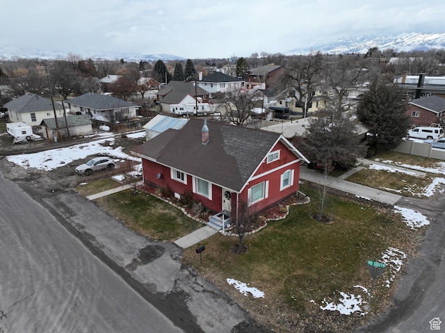 snowy aerial view featuring a mountain view