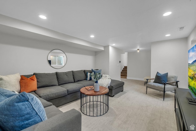living area with baseboards, light carpet, recessed lighting, stairway, and visible vents
