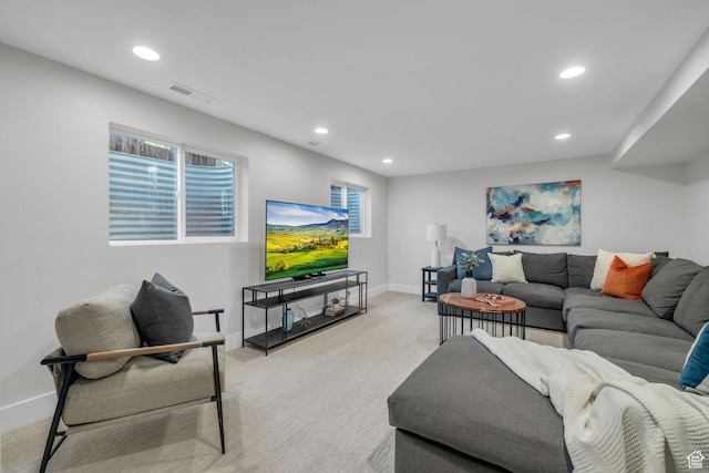 living room with light carpet, recessed lighting, visible vents, and baseboards