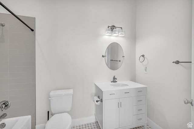 full bathroom with toilet, vanity, and tiled shower / bath