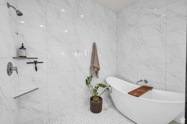 bathroom with tile walls and shower with separate bathtub
