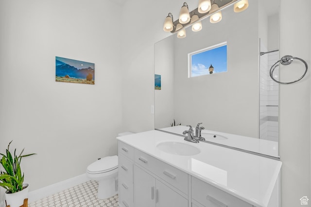 bathroom featuring toilet, vanity, and tile patterned floors