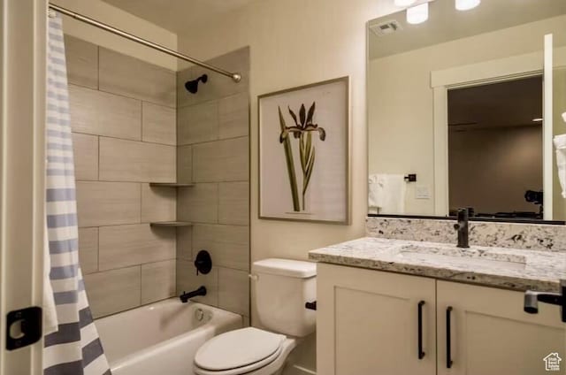 full bathroom featuring toilet, shower / bathtub combination with curtain, and vanity