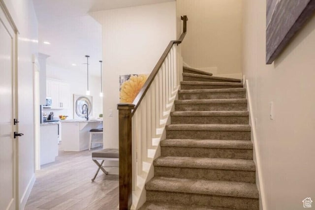 stairway featuring hardwood / wood-style flooring