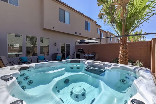 view of pool featuring a hot tub