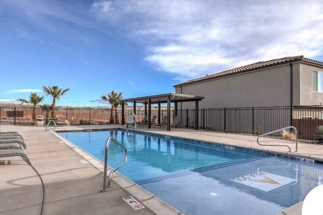 view of swimming pool with a patio