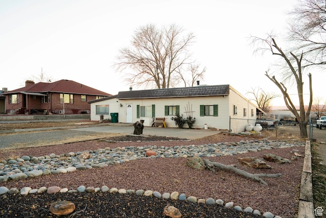 rear view of house featuring a patio