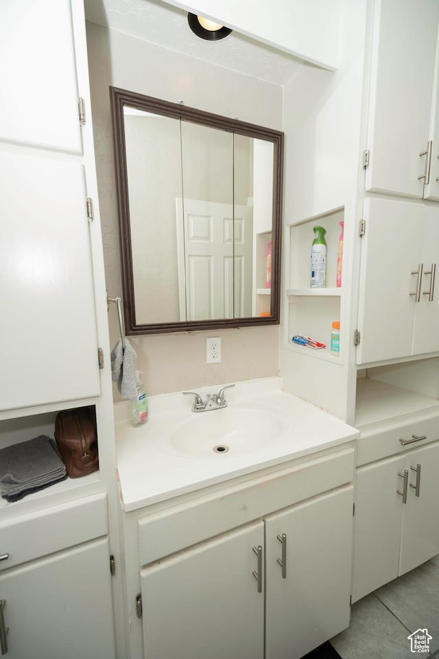 bathroom with vanity and tile patterned flooring