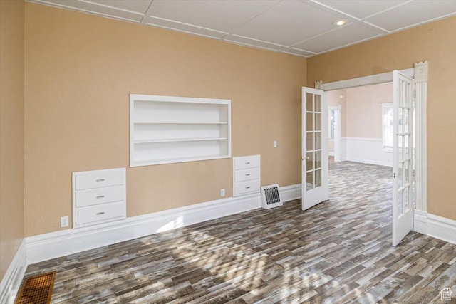 119 N 200 E, Smithfield, UT 84335 - empty room featuring french doors, wood finished floors, built in features, and baseboards