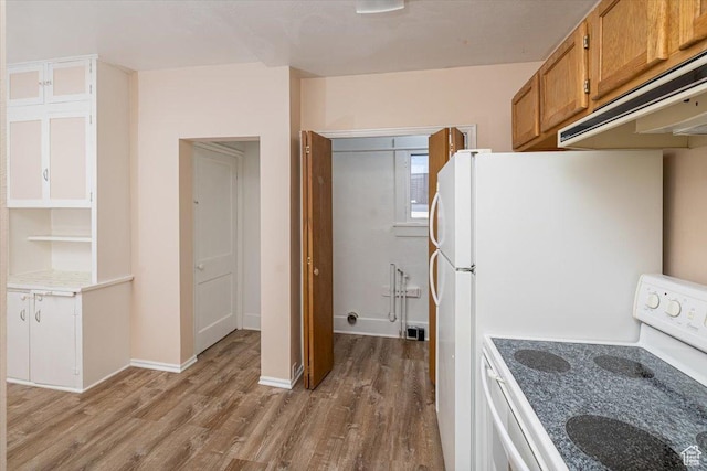119 N 200 E, Smithfield, UT 84335 - kitchen with white range with electric stovetop, under cabinet range hood, wood finished floors, brown cabinets, and light countertops