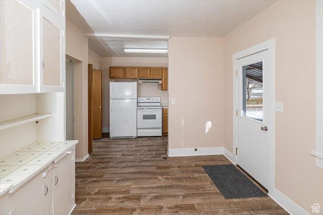 119 N 200 E, Smithfield, UT 84335 - kitchen featuring white appliances, tile countertops, ventilation hood, dark wood-style flooring, and baseboards