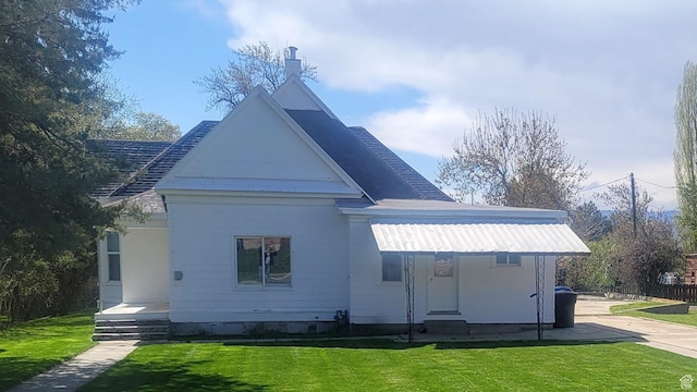119 N 200 E, Smithfield, UT 84335 - rear view of property with a lawn