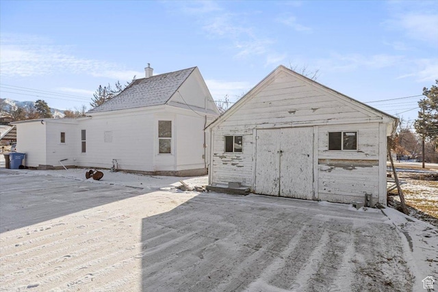 119 N 200 E, Smithfield, UT 84335 - back of property featuring an outbuilding, a storage unit, and a chimney