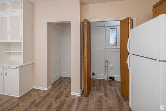 119 N 200 E, Smithfield, UT 84335 - washroom featuring wood finished floors and baseboards