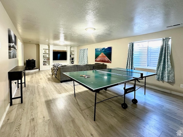 1094 W 400 S, Layton, UT 84041 - playroom with a textured ceiling, light wood finished floors, built in features, and baseboards