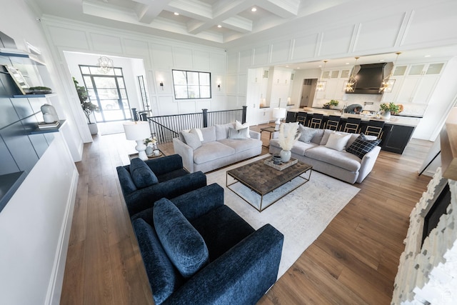 287 E Heritage Dr, Alpine, UT 84004 - living area with beam ceiling, coffered ceiling, dark wood-type flooring, a towering ceiling, and a chandelier