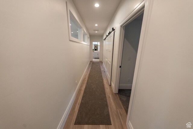 287 E Heritage Dr, Alpine, UT 84004 - hall featuring a barn door, recessed lighting, and wood finished floors