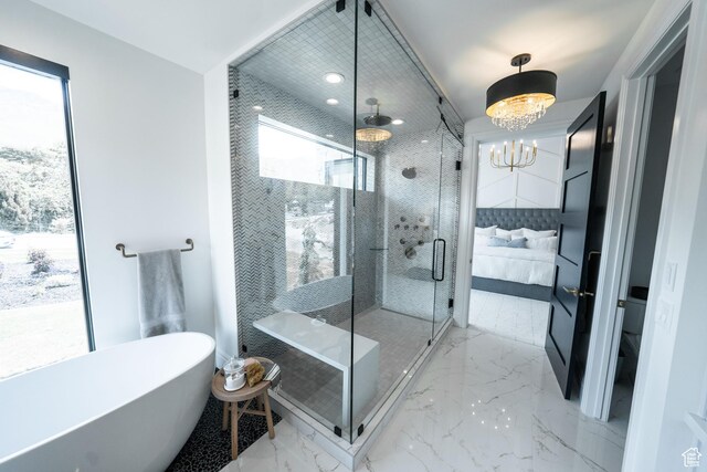 287 E Heritage Dr, Alpine, UT 84004 - full bathroom with connected bathroom, a soaking tub, a stall shower, marble tiled flooring, and a chandelier