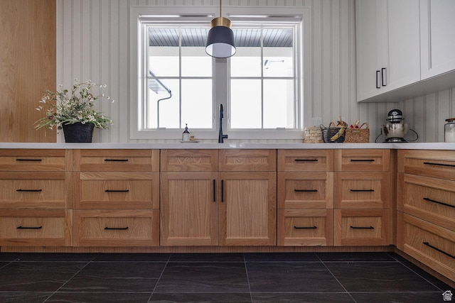 287 E Heritage Dr, Alpine, UT 84004 - kitchen with dark marble finish floors, healthy amount of natural light, and light countertops