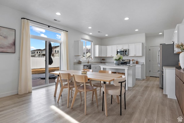 328 W 720th St S, American Fork, UT 84003 - dining area with sink and light wood-type flooring