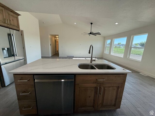 1030 N 200 E, Ferron, UT 84523 - kitchen with stainless steel appliances, a sink, open floor plan, a ceiling fan, and a textured ceiling